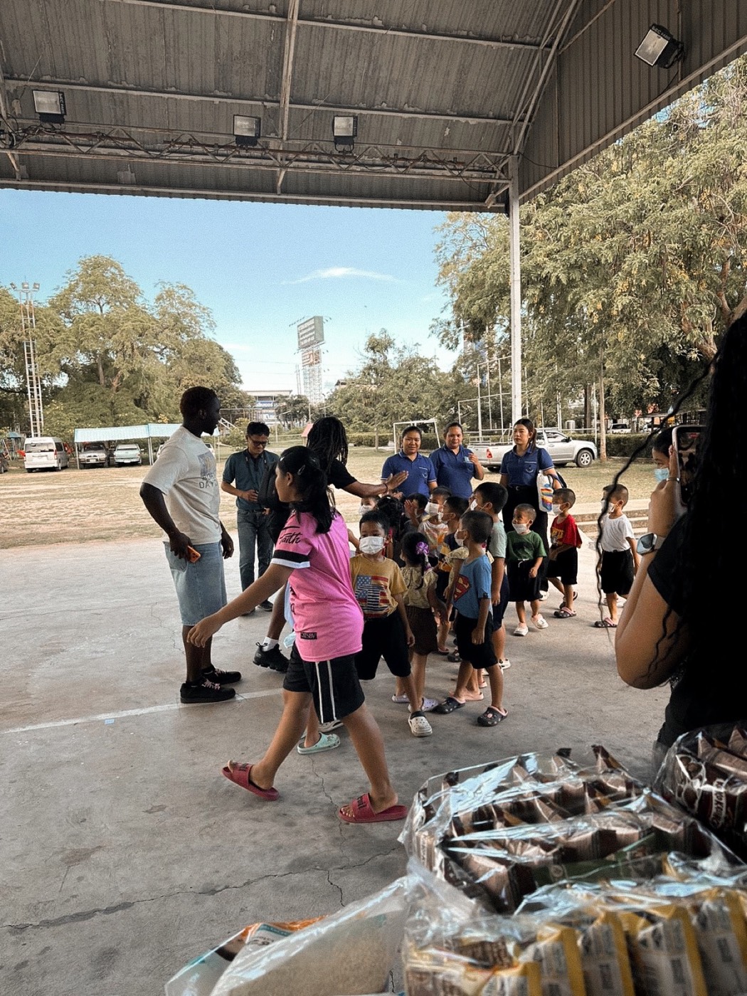 Zion Fajemilugba spending time with children at an orphanage in Pattaya, Thailand